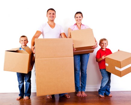 Professional movers loading furniture for a Beddington home move